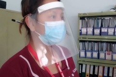 GP nurse with improvised face shield 270320
