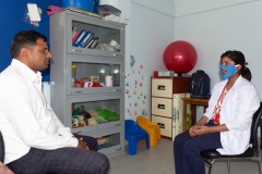 Speech therapy session practice with the semi transparent mask showing the movement of mouth to the person with hearing loss-Photo-Sagar Malla