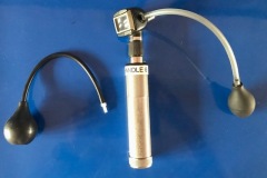 Otoscope with pneumatic bulbs for testing drum mobility.